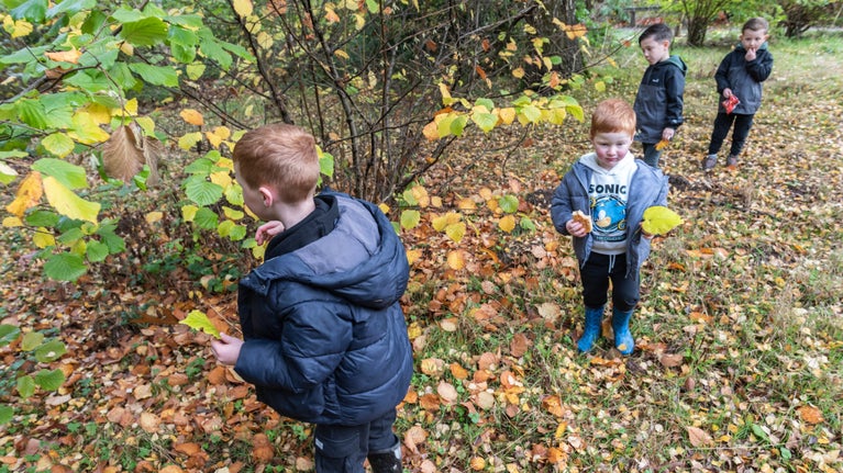 Families exploring the garden at Calke Abbey, Derbyshire, in winter
